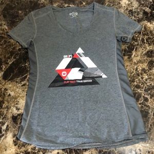 Grips Women’s Grey V Neck T shirt. Size: S